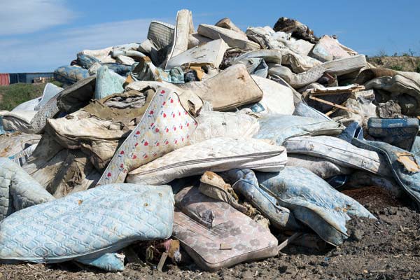 Old mattresses at a landfill dump