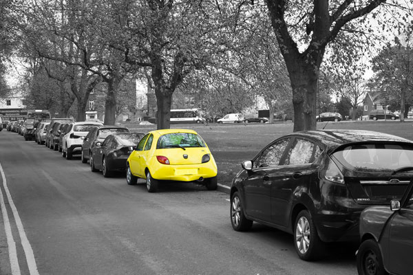 yellow car parked on street